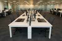 Alias meeting room chair upholstered in black mesh on chrome frame
