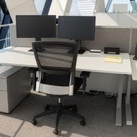 Grey laminate rectangular height adjustable desk. 