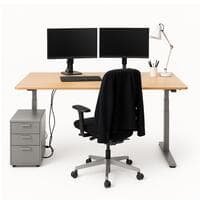 Light timber rectangular height adjustable desk. 1400mm x 700mm